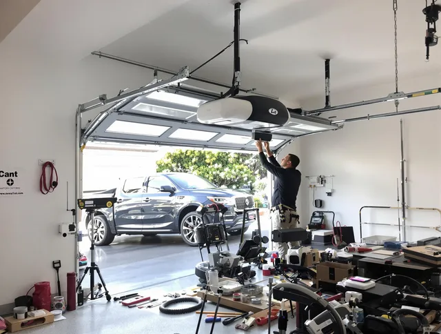 East Hampton Garage Door Repair specialist installing smart garage door opener system in East Hampton home