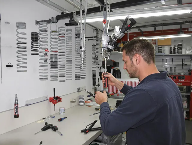 East Hampton Garage Door Repair safety certified technician performing precision spring replacement in East Hampton